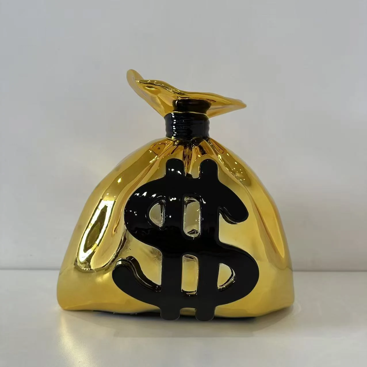 Small gold money-bag decorative display